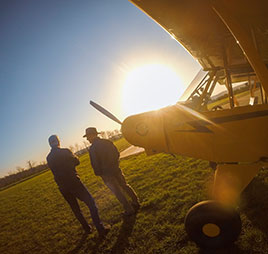 Photo of two people standing in front of plane. Link to Gifts of Life Insurance. Photo of two people standing in front of plane. Link to Gifts of Life Insurance.